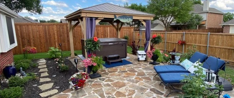 Flagstone patio and a pavilion over a hot tub.