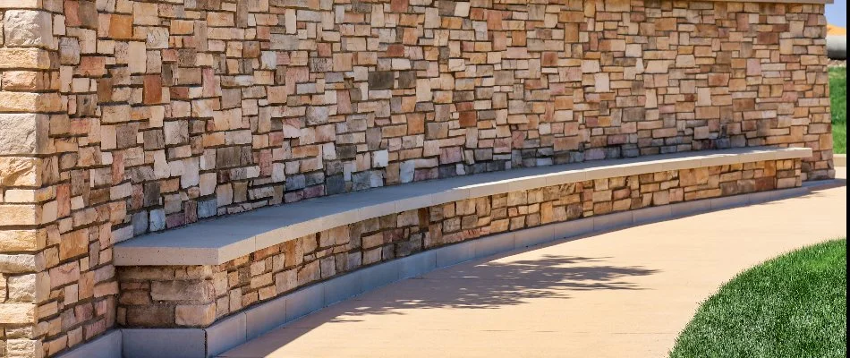 Large seating wall along a walkway on a commercial property in McKinney, TX.