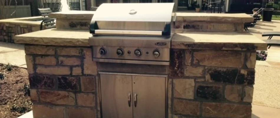 Outdoor kitchen in McKinney, TX, equipped with a grill.