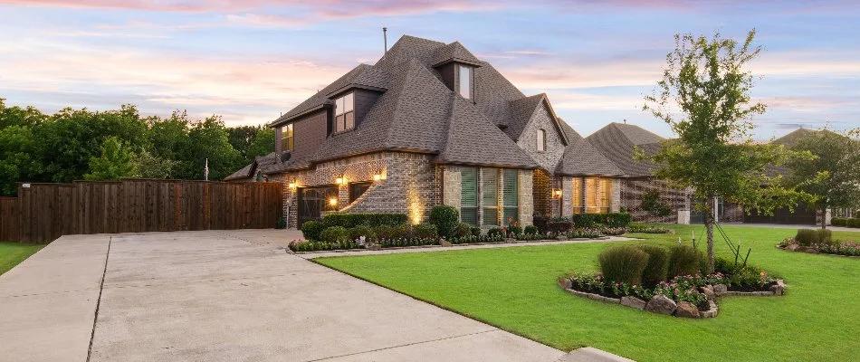 Side view of residence with beautiful landscaping in McKinney, TX.