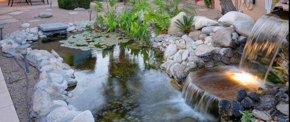 Water feature in McKinney, TX, with stones and lighting.