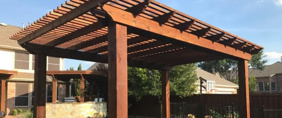 A wooden arbor in an outdoor living space in McKinney, TX.