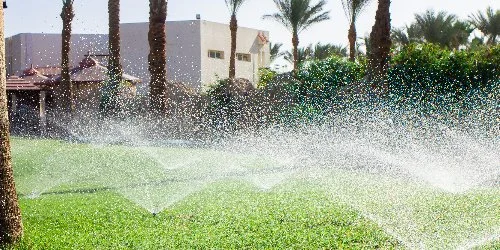 Commercial property in Prosper, TX with the sprinkler system watering the lawn.